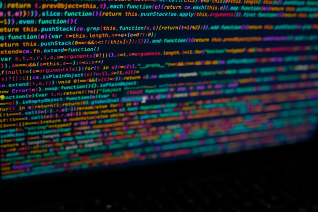 A close-up of a computer screen with lines of code in multiple colours