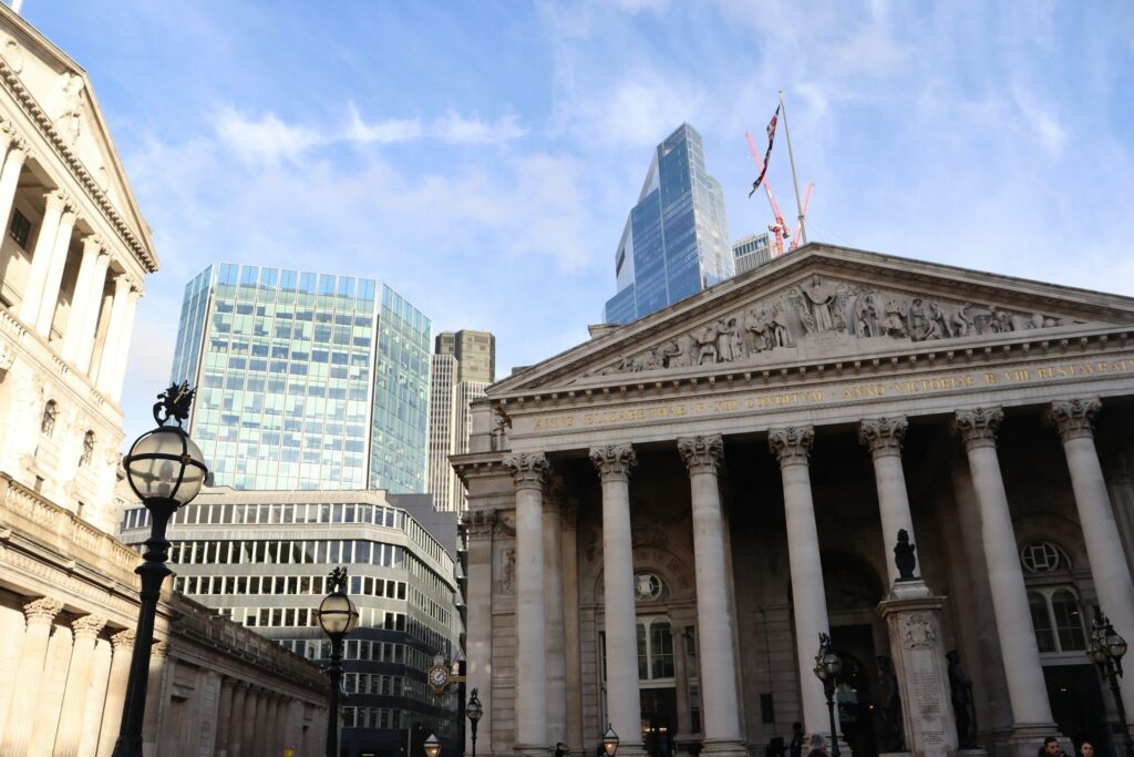A cityscape shot with a traditional banking building in the foreground