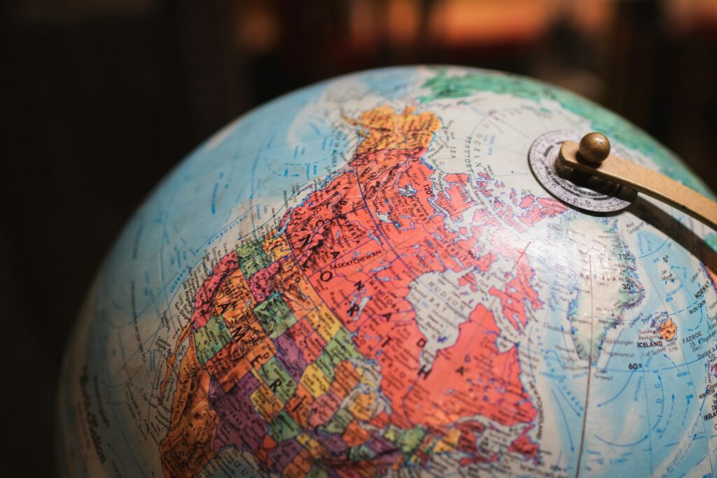 Close-up of a desk globe showing north america and the north atlantic, concept image for the fatf grey list global operations